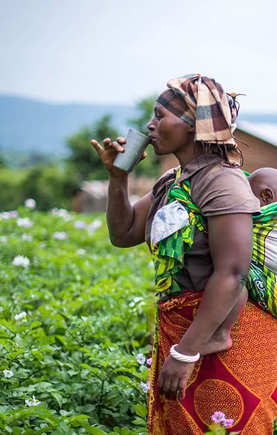 Woman carrying baby on back in Tanzania